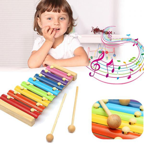 Colorful wooden xylophone with multicolored bars and mallet Colorful wooden xylophone with multicolored bars and mallet